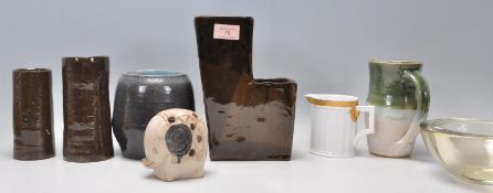 A mixed group of Studio Art pottery ceramics with a brown glazed L shaped vase with two sections