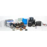A collection of retro vintage video and camera equipment to include a Minolta 7000, A Polaroid