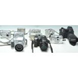 A collection of vintage digital cameras to include an Olympus Camedia C370, Fuji Finepix F700, Nikon