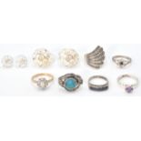 A collection of silver dress rings to include 5 stone ring, flower head ring. solitaire ring, rose