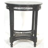 A 19th Century Victorian aesthetic movement black lacquered round occasional / side central table