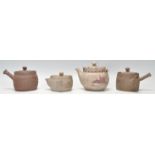 A collection of Chinese teapots to include 2 clay hand painted examples, one with butterfly