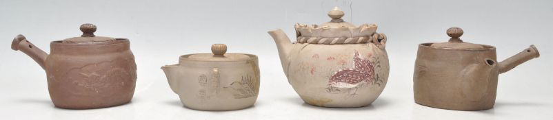 A collection of Chinese teapots to include 2 clay hand painted examples, one with butterfly