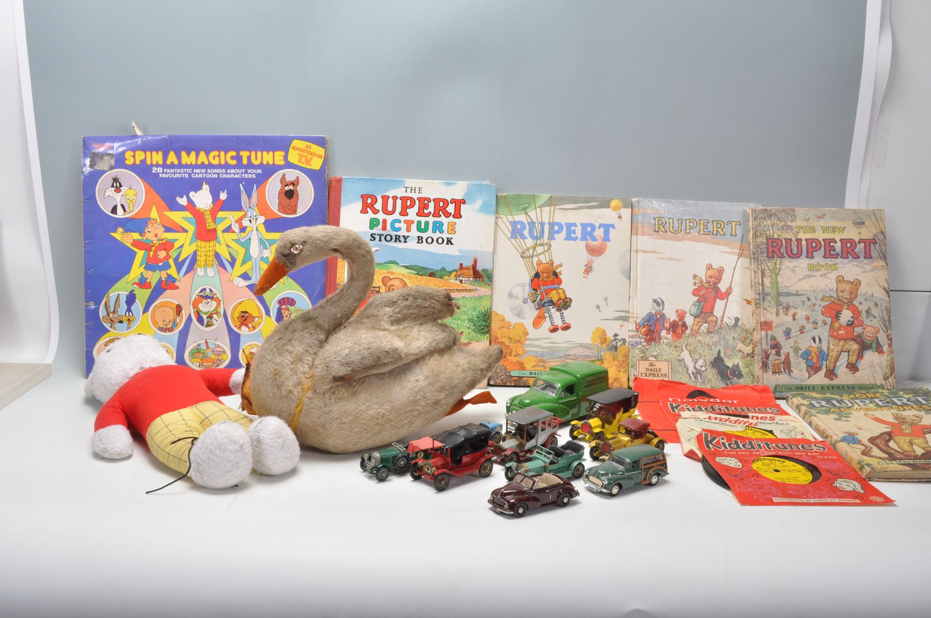 A collection of vintage children's toys to include a selection of Rupert annual books, a Rupert Bear