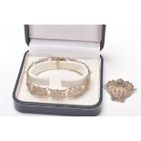 A good silver hallmarked bracelet having pierced floral panels with a push button clasp and safety