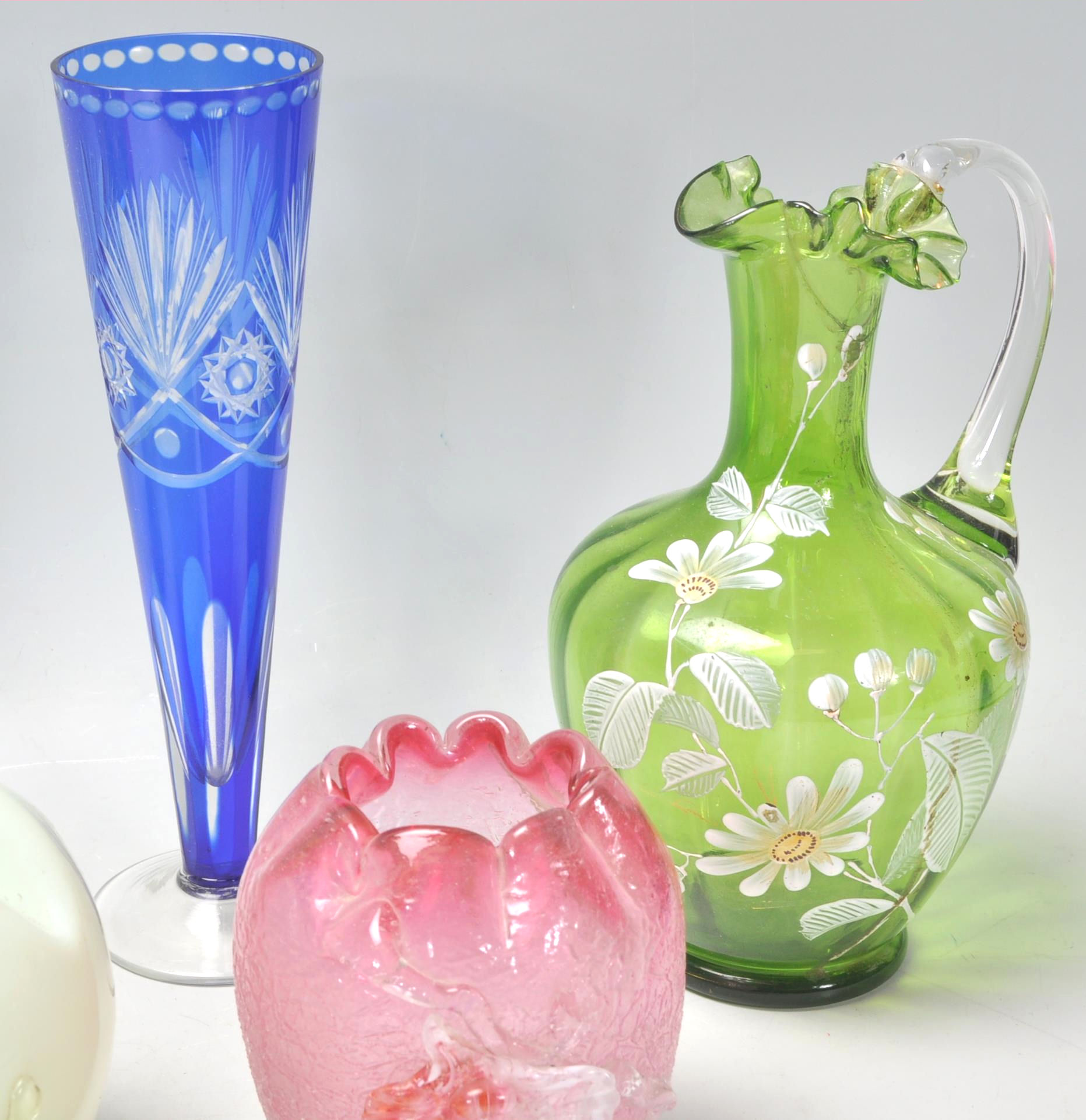 A group of 19th Century Victorian coloured glass vases to include a yellow and white vase with - Image 5 of 7