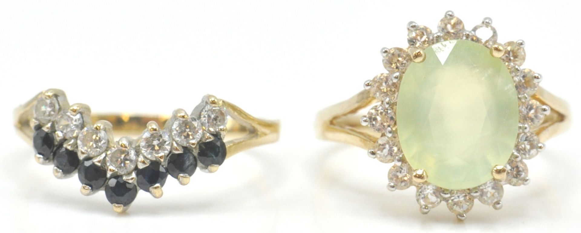 A 9ct gold hallmarked cluster ring. The yellow facet cut stone within a halo of white stones.