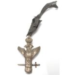 A 20th century cast metal Masonic double headed eagle medal modelled with a crown and holding a