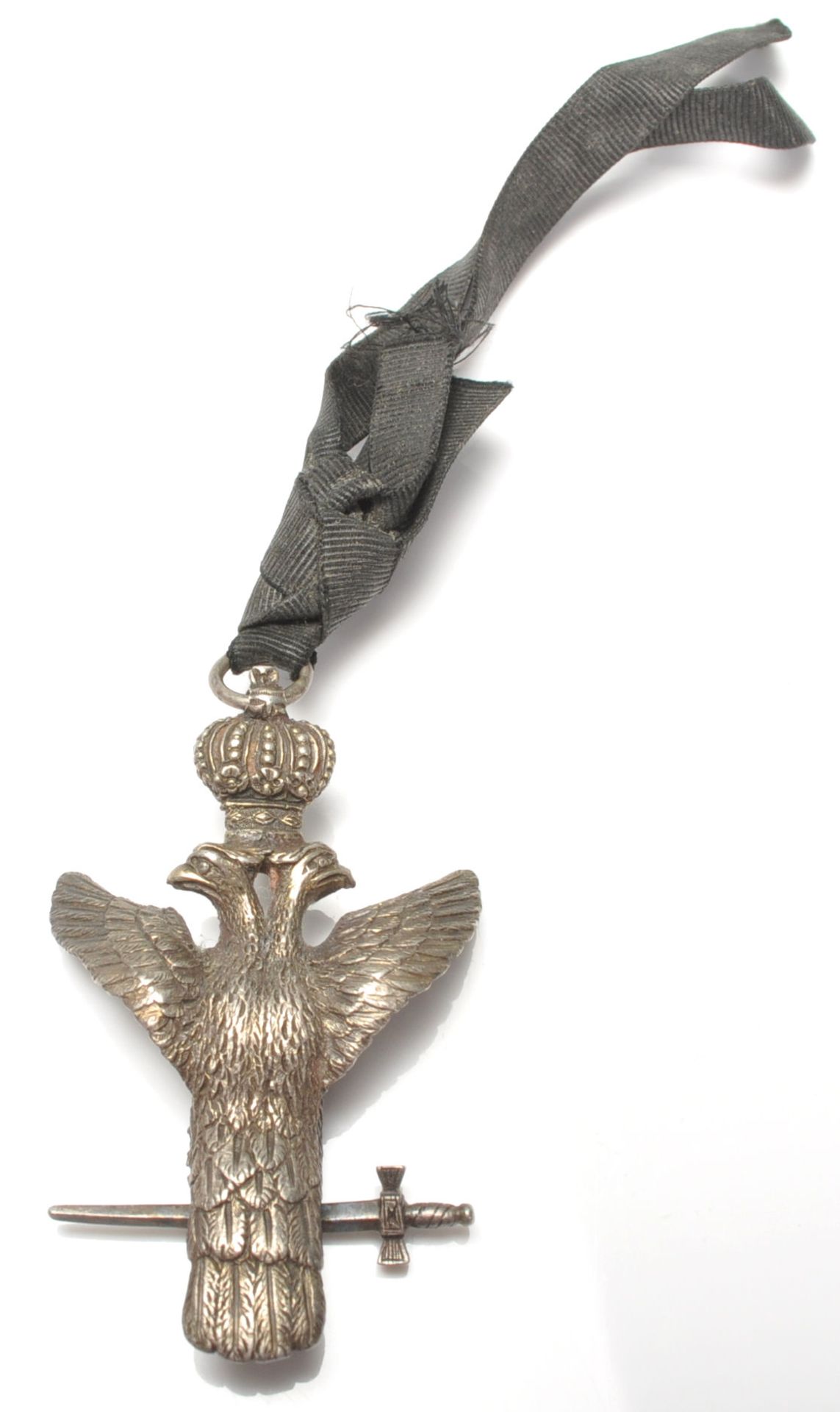 A 20th century cast metal Masonic double headed eagle medal modelled with a crown and holding a