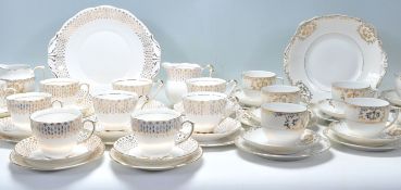 A mixed group of three Fine Bone China English gilt part tea services. One service by Queen Anne