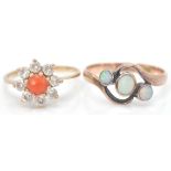 A 9ct gold hallmarked coral and white stone cluster ring. The central cabochon coral with halo of