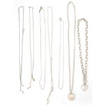 A group of seven silver ladies necklace chains to include a box link example having a spring ring