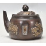 A Antique Chinese miniature brass inkwell in the form of a teapot having applied barss decoration