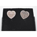 A pair of sterling silver Tiffany & Co style heart shaped earrings. The earrings have PLEASE