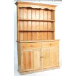 A 19th Century Victorian country pine dresser of good size raised on a plinth base with 2