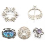 A collection of 4 silver hallmarked / 925 Scottish brooches to include a celtic knot, roundel