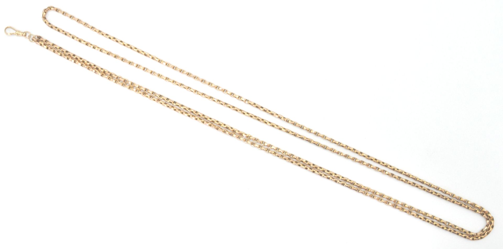 A large 9ct gold langard / necklace chain with kerb linkage measuring total length of 138cms and set