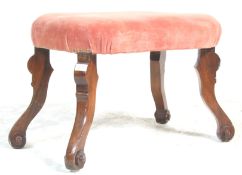 A 19th century George III walnut framed ottoman footstool. Raised on walnut serpentine shaped legs