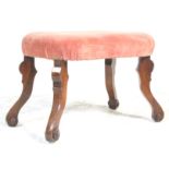 A 19th century George III walnut framed ottoman footstool. Raised on walnut serpentine shaped legs