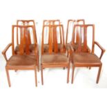 A set of six vintage retro Nathan teak wood framed dining chairs having pierced back rests with