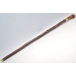 A vintage 20th Century bamboo sword stick / walking stick cane having a root knot ball knob to