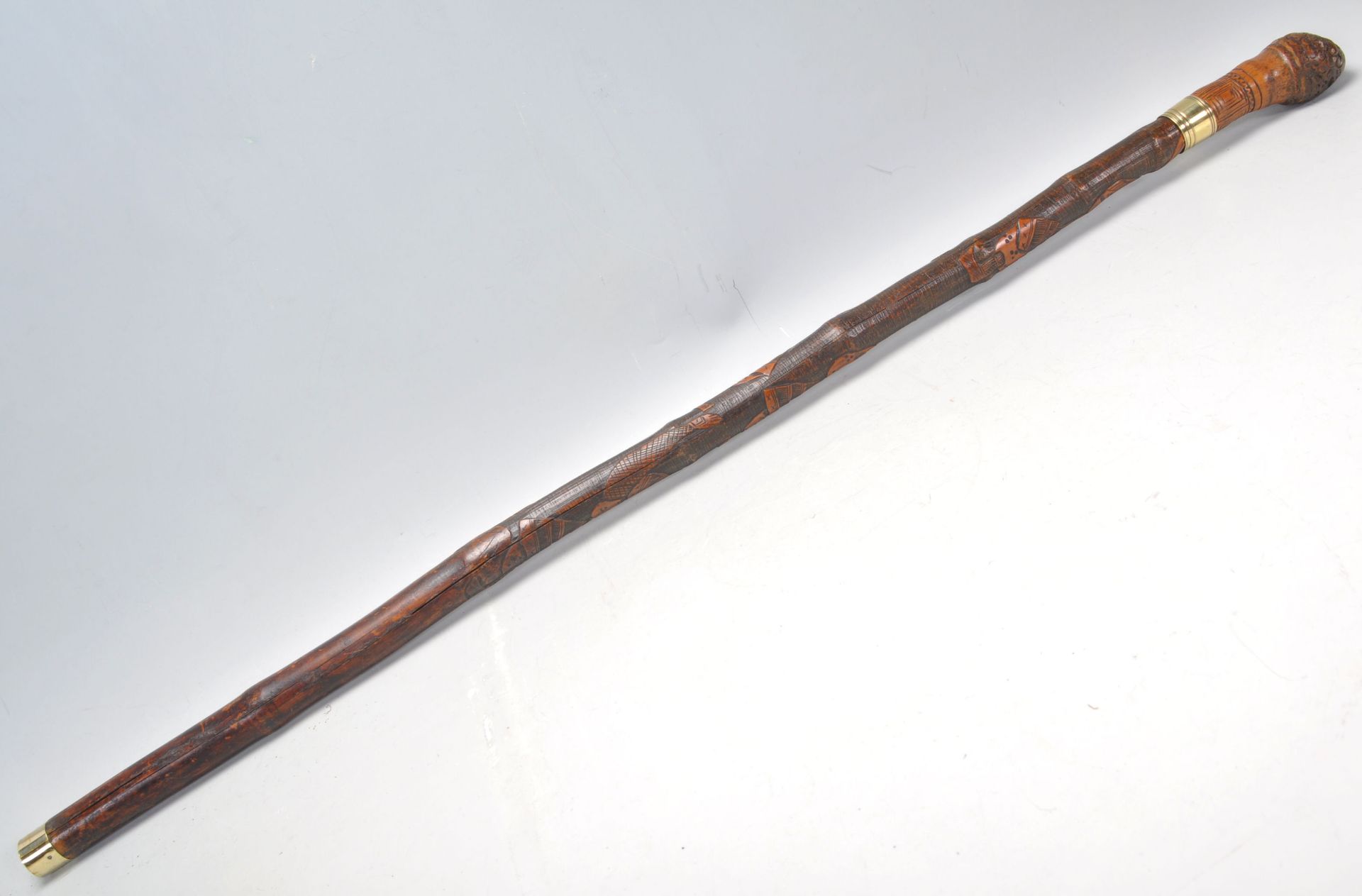 A vintage 20th Century bamboo sword stick / walking stick cane having a root knot ball knob to