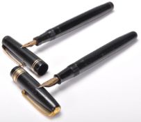 Two vintage fountain ink writing pens to include a Waterman's and a Swan pen, both having black