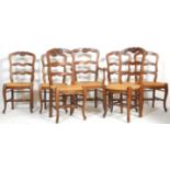 A set of 7 19th century Provincial French oak dining chairs. Provence Brittany, with sabre legs