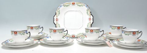 An early 20th Century Art Deco tea service by Balmoral China having white ground with black rim