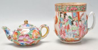 An antique 19th century Chinese Canton famille rose teacup with polychrome decoration depicting