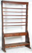A 19th century Victorian large country stained pine open plate rack shelf wall unit having three