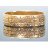 A stamped 916 22ct gold band ring having engraved geometric decoration. Weight 3.1g. Size O.