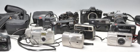 A collection of vintage cameras to include a Pentax MG camera with lens, Fuji Discovery 975, Canon