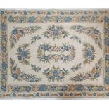 A 20th Century Indian Raj Period style wool floor rug / wall hanging having a cream ground with