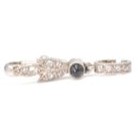 An early 20th century French platinum, onyx and diamond set dog clip baille - bale. The bale with