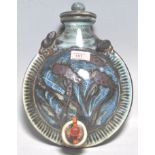 A vintage retro 20th century studio art pottery flask /keg of round moonflask form having a wooden