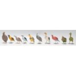 A set of 20th Century folk art bird figurines constructed from paper mache with wire work legs, each