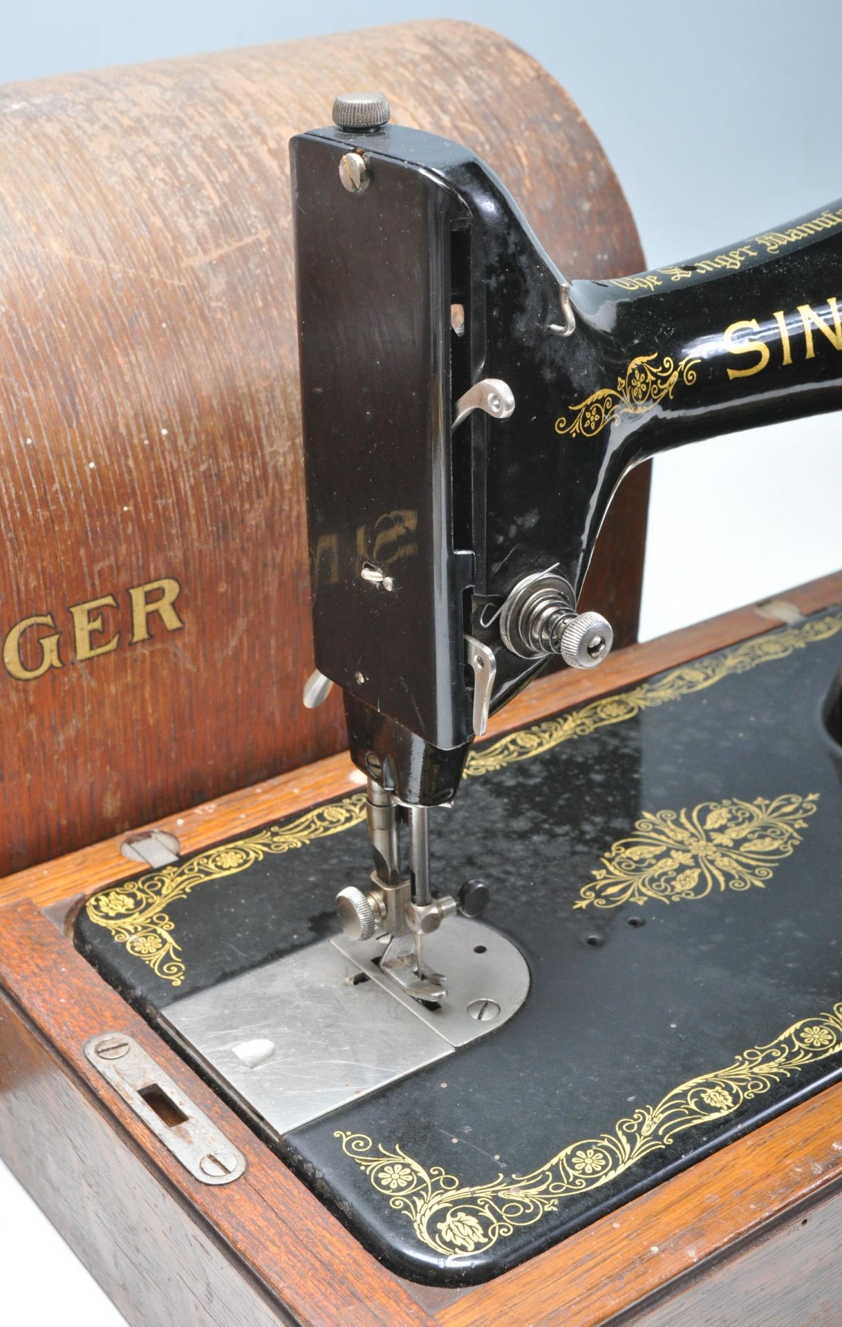 A 19th Century Victorian Singer sewing machine having an ebonised metal body set within a wooden - Image 3 of 5