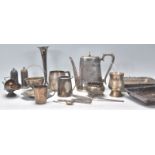 A mixed group of vintage silver plate wares dating from the early 20th Century to include large milk