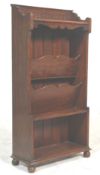 A 1930's oak old charm style office filing cabinet having a carved gallery top with two slanted