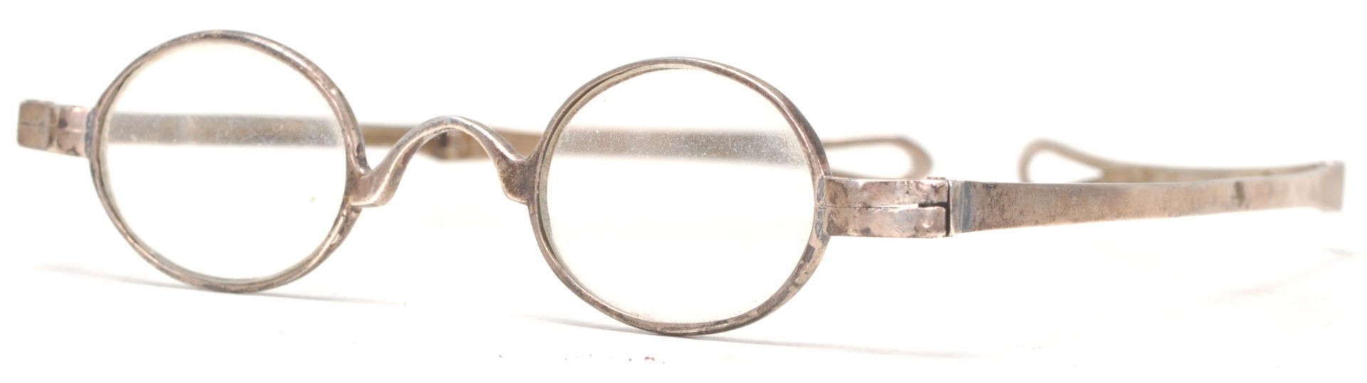 A pair of early 19th Century Georgian silver folding spectacle wig glasses. Fully hallmarked with