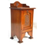 A 19th Century Victorian antique English mahogany country house fireside coal box having a carved