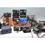 A collection of vintage cameras to include a Polaroid Supercolor 670 AF camera, a Polaroid 636