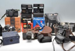 A collection of vintage cameras to include a Polaroid Supercolor 670 AF camera, a Polaroid 636