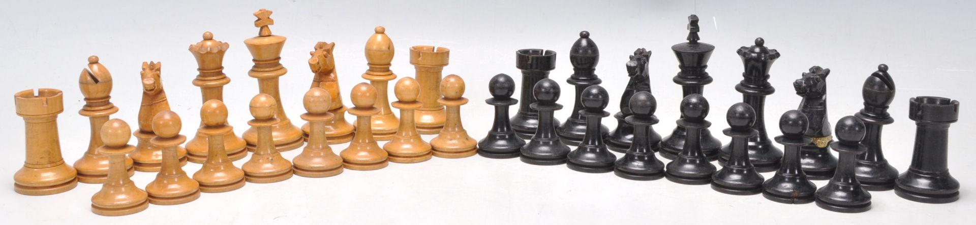 A complete set of vintage style wooden carved chess pieces. Measures 6cms high.