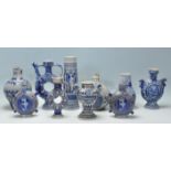 A collection of 20th Century German blue and grey stoneware ballamine style vessels to include