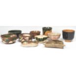 A collection of Chinese cream and green glaze finger bowls, rice bowls and saki cups. To include