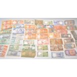 A collection of 20th Century bank notes to include Indian rupees and Caribbean notes including