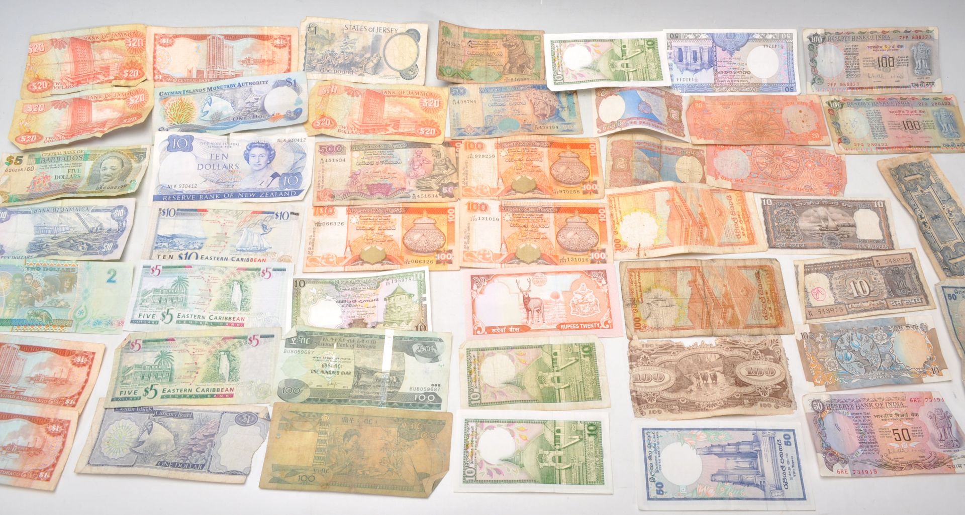 A collection of 20th Century bank notes to include Indian rupees and Caribbean notes including