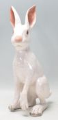 A vintage retro ceramic pottery figure in the form of a hare having a white crackle glazed finish